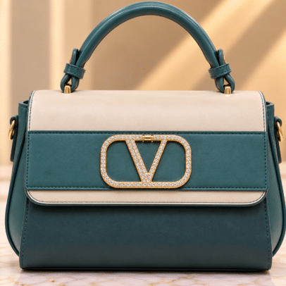 Teal_and_ivory_crystal-emblem_handbag_cleaned